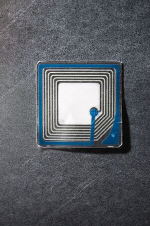 Rfid tag on a metal tableの写真素材