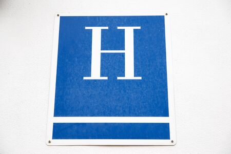 Hotel sign on a wall in Spain.の写真素材