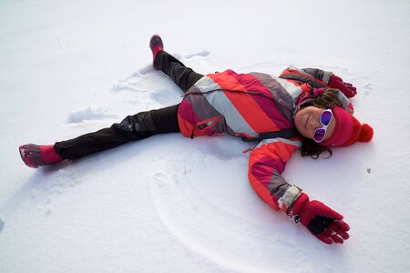 Little girl playing in the snow, Pyrenees, Spain.の写真素材