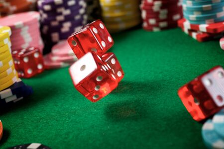 Rolling the dices on a game table in a casino.の写真素材