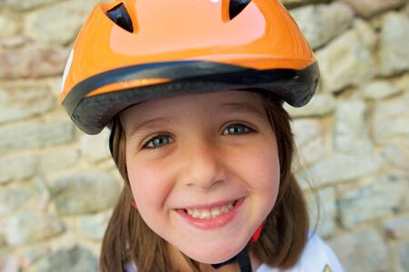 Portrait of a girl with protective helmet.の写真素材