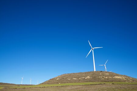 Windmills for electric power production, Huesca province, Aragon in Spain.