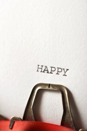 The word Happy written with a typewriter.の写真素材