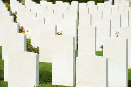 Bayeux, France - August 20, 2014: Headstones lined up in the British cemetery