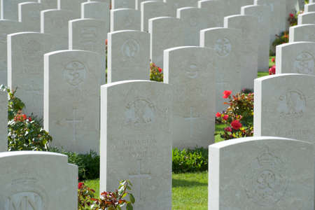 Bayeux, France - August 20, 2014: Headstones lined up in the British cemetery