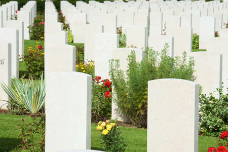 Bayeux, France - August 20, 2014: Headstones lined up in the British cemetery