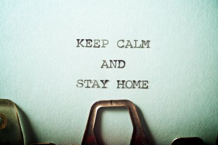 Keep calm and stay home text written on a paper.の写真素材