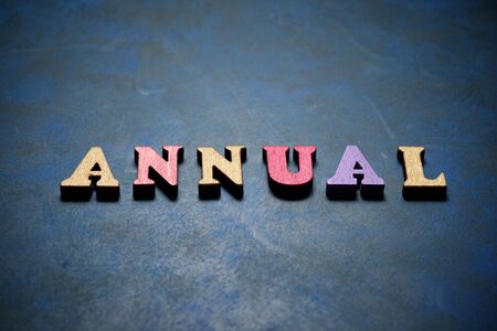 Annual word on a blue table.