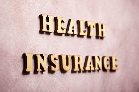 Health insurance text on a colored paper.の写真素材