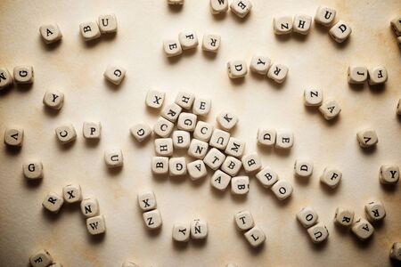Letter cubes on a brown paper.の写真素材