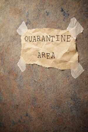 Quarantine area text on a wall.の写真素材