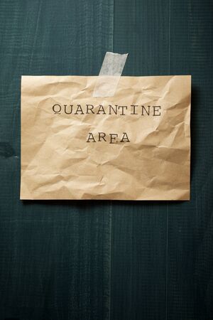Quarantine area text on a wall.の写真素材