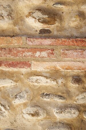 Front view of an old brick wall in Spain.