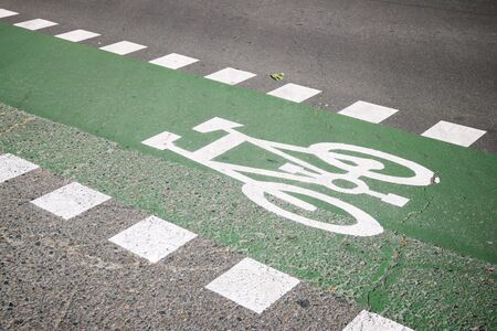 Bike lane sign painted on a street in Zaragoza, Spain.
