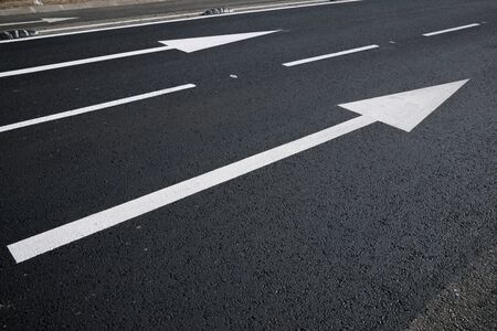 Two arrow directional signals on the floor.