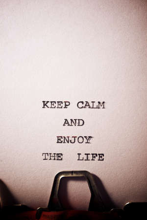 Keep calm and enjoy the life text written on a paper.の写真素材