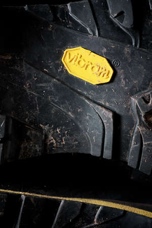 Zaragoza, Spain - October 21, 2021: Logo of the shoe sole brand, known as Vibram, on the sole of a hiking boot.のeditorial素材