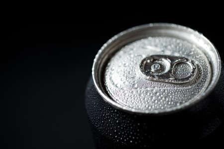 Close-up of a can of soda on a table.