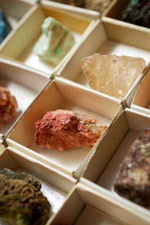 Collection of minerals in cardboard boxes.