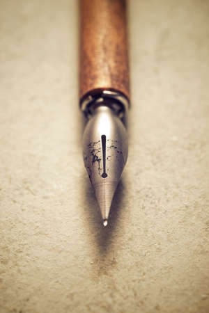 Nib pen for calligraphy on a table.の写真素材