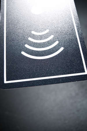 Hotel contactless card on a black table.
