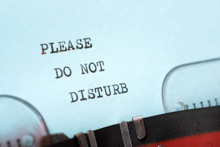 Please do not disturb phrase written with a typewriter.