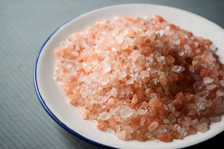 Himalayan salt on a white plate.
