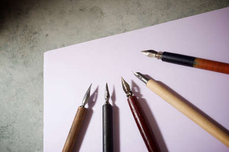 Nib pens for calligraphy on a table.の写真素材