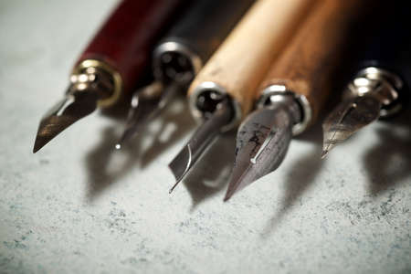 Nib pens for calligraphy on a table.の写真素材