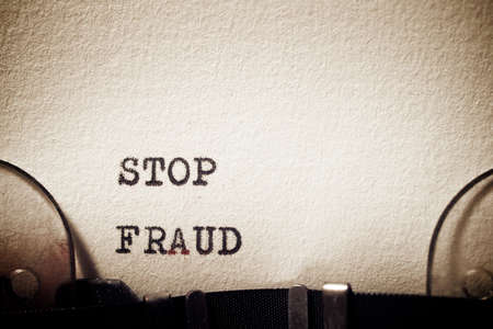 Stop fraud phrase written with a typewriter.