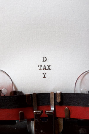 Tax day phrase written with a typewriter.の写真素材
