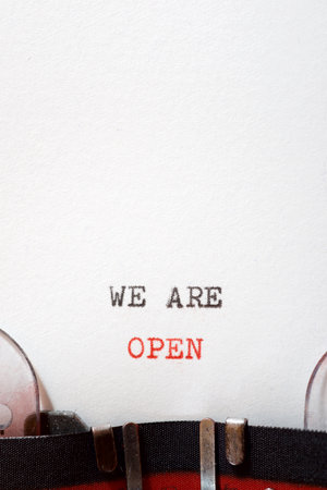 We are open phrase written with a typewriter.の写真素材