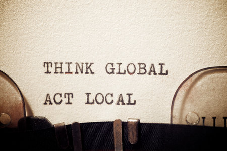 Think global act local phrase written with a typewriter.の写真素材