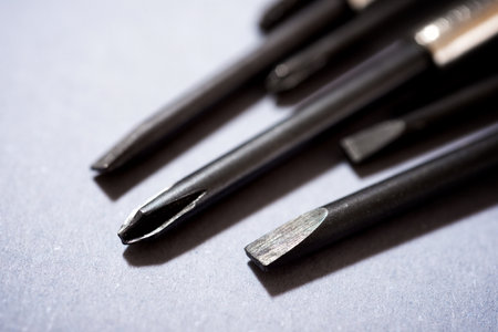 Screwdrivers on a gray tableの写真素材