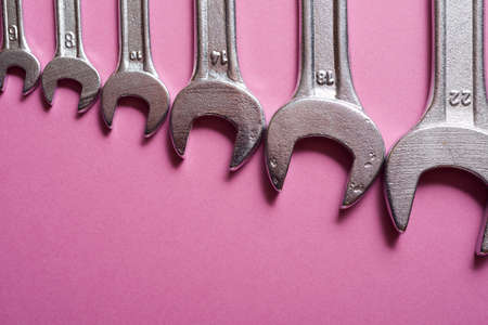 Wrenches on a purple table.の写真素材
