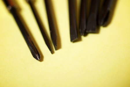 Screwdrivers on a yellow table