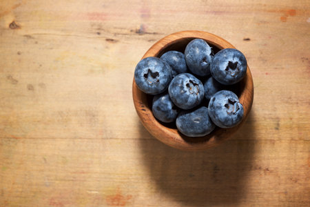 Close up of a blueberries in a wood bowl.の写真素材