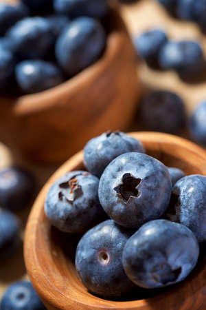 Close up of a blueberries in a wood bowl.の写真素材