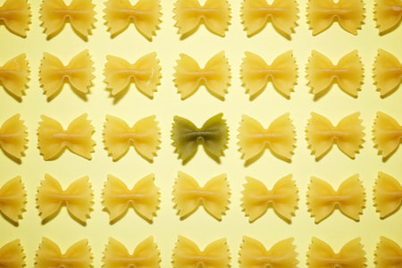 Pasta ties on a yellow table.の写真素材