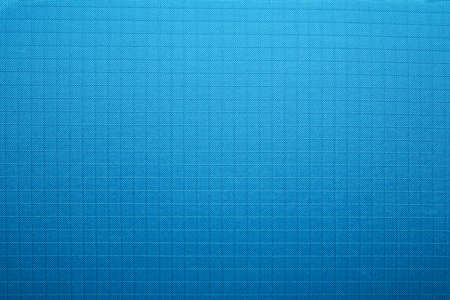 Close-up of the fabric of a waterproof mountain backpack.