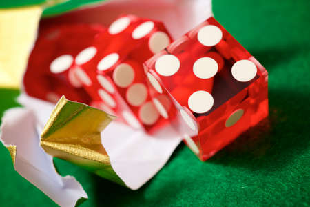 Casino dices in gold foil wrapper.