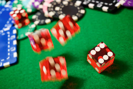Rolling the dices on a game table in a casino.の写真素材