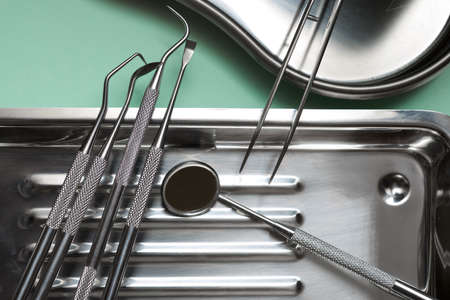 Instruments used by the dentist on a metal tray.の写真素材