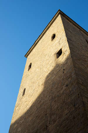 Medieval tower, known as the prison tower or clock tower, in the city of Jaca, Pyrenees, Huesca province, Aragon in Spain.の写真素材