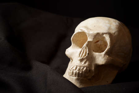Clay figure of a human skull.