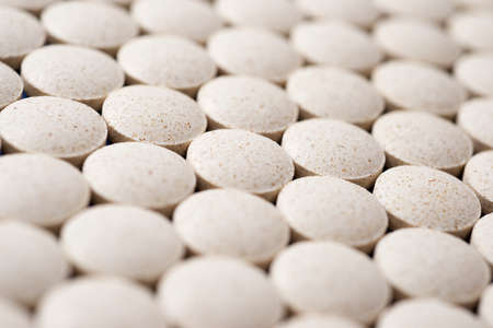 Close-up of some pills lined up.