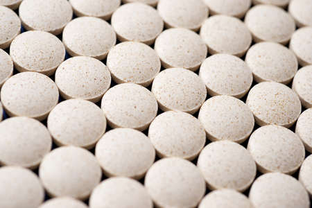 Close-up of some pills lined up.