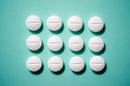 Pills on a green table.の写真素材