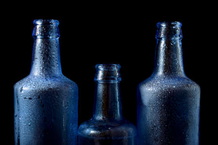 Glass bottles on a table.の写真素材