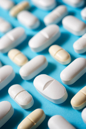 Pills on a blue table.の写真素材